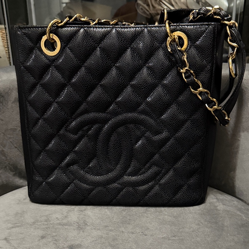 CHANEL Black Quilted Caviar Leather Petite Shopper with Gold Hardware.